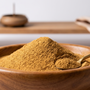 Pure natural sandalwood powder in a traditional wooden bowl with a sandalwood log